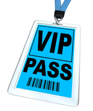 A blue badge and lanyard reading V.I.P. Pass
